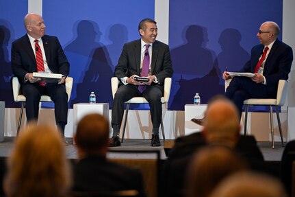 Edwin Oshiba, center, acting secretary of the Air Force for energy, installations, and environment, speaks during a panel discussion for the 2022 Association of Defense Communities National Summit in Arlington, Va., March 8, 2022. Oshiba spoke about the priorities and challenges for Air Force installations. (U.S. Air Force photo by Eric Dietrich)