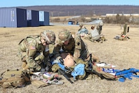Combat medics with the Pennsylvania National Guard treat a simulated casualty as part of the TC8-800 medic sustainment course March 2 at Fort Indiantown Gap, Pa. The course, which was held Feb. 17-March 3, gave the 17 participants the opportunity to train together with other medics outside their home units, without taking up time during drill weekends where most training is conducted. (U.S. Army National Guard photo by Staff Sgt. Zane Craig)