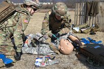 Combat medics with the Pennsylvania National Guard treat a simulated casualty as part of the TC8-800 medic sustainment course March 2 at Fort Indiantown Gap, Pa. The course, which was  held Feb. 17-March 3, gave the 17 participants the opportunity to train together with other medics outside their home units, without taking up time during drill weekends where most training is conducted. (U.S. Army National Guard photo by Staff Sgt. Zane Craig)