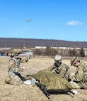 Combat medics with the Pennsylvania National Guard treat a simulated casualty as part of the TC8-800 medic sustainment course March 2 at Fort Indiantown Gap, Pa. The course, which was held Feb. 17-March 3, gave the 17 participants the opportunity to train together with other medics outside their home units, without taking up time during drill weekends where most training is conducted. (U.S. Army National Guard photo by Staff Sgt. Zane Craig)