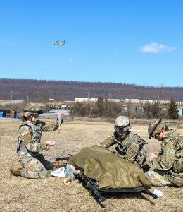Combat medics with the Pennsylvania National Guard treat a simulated casualty as part of the TC8-800 medic sustainment course March 2 at Fort Indiantown Gap, Pa. The course, which was held Feb. 17-March 3, gave the 17 participants the opportunity to train together with other medics outside their home units, without taking up time during drill weekends where most training is conducted. (U.S. Army National Guard photo by Staff Sgt. Zane Craig)