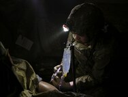 Sgt. Andrew Swartwood, a combat medic with 1st Battalion, 112th Infantry Regiment, 56th Brigade Combat Team, 28th Infantry Division, Pa. Army National Guard, treats a simulated casualty during the final evaluation event of the TC8-800 medic sustainment course March 3 at Fort Indiantown Gap, Pa. The course, which was  held Feb. 17-Mar. 3, gives the 17 participants the opportunity to train together with other medics outside their home units, without taking up time during drill weekends where most training is conducted. (U.S. Army National Guard photo by Staff Sgt. Zane Craig)