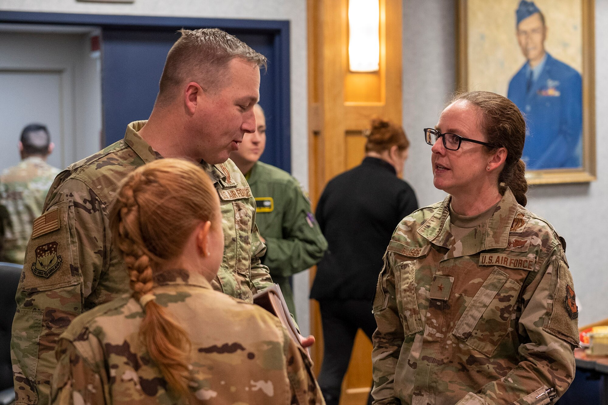 Brig. Gen. Stacy Jo Huser, principal assistant deputy administrator for military application, speaks with Col. Anita Feugate Opperman, 341st Missile Wing commander and Col. Daniel Voorhies, 341st MW vice commander March 9, 2022, during her visit to Malmstrom Air Force Base, Mont.