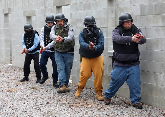 Civil Service Mariners practice clearing spaces of simulated security threats at the Military Sealift Command Training Center East on Joint Base Langley-Fort Eustis, Virginia, Feb. 24.