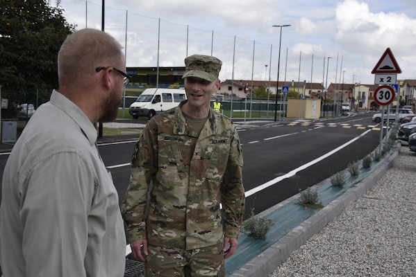 U.S. Army Corps of Engineers, Europe District Italy Real Estate Field Office Chief Mark Harkison discusses Europe District’s real estate mission in Italy with Europe District Commander Col. Pat Dagon at the recently completed Via dei Martinelli roadway project leading onto a U.S. installation in Longare, Italy October 4, 2021. The recently completed road improvements were completed off the nearby base, requiring a great deal of real estate support and coordination. (U.S. Army photo by Chris Gardner)