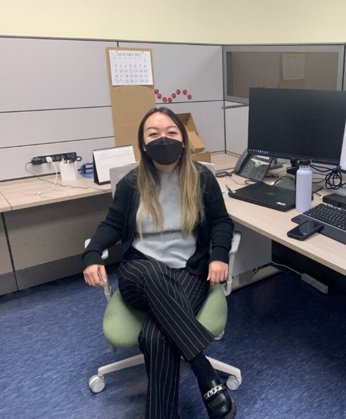 Kayla Toy, Far East District intern, poses for a photo at her desk in the Programs and Project Management Department, located in the headquarters building, March 7. Toy had the opportunity to learn from the Office of Counsel, Internal Review, and the Geotechnical and Environmental Branch. (Courtesy photo)