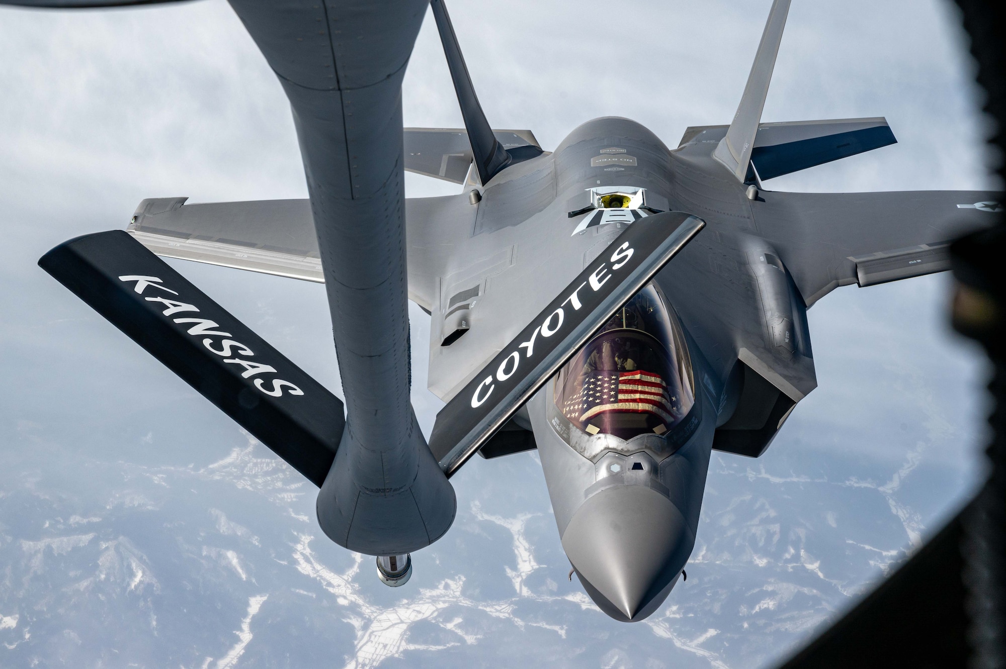 A jet approaches an aircraft