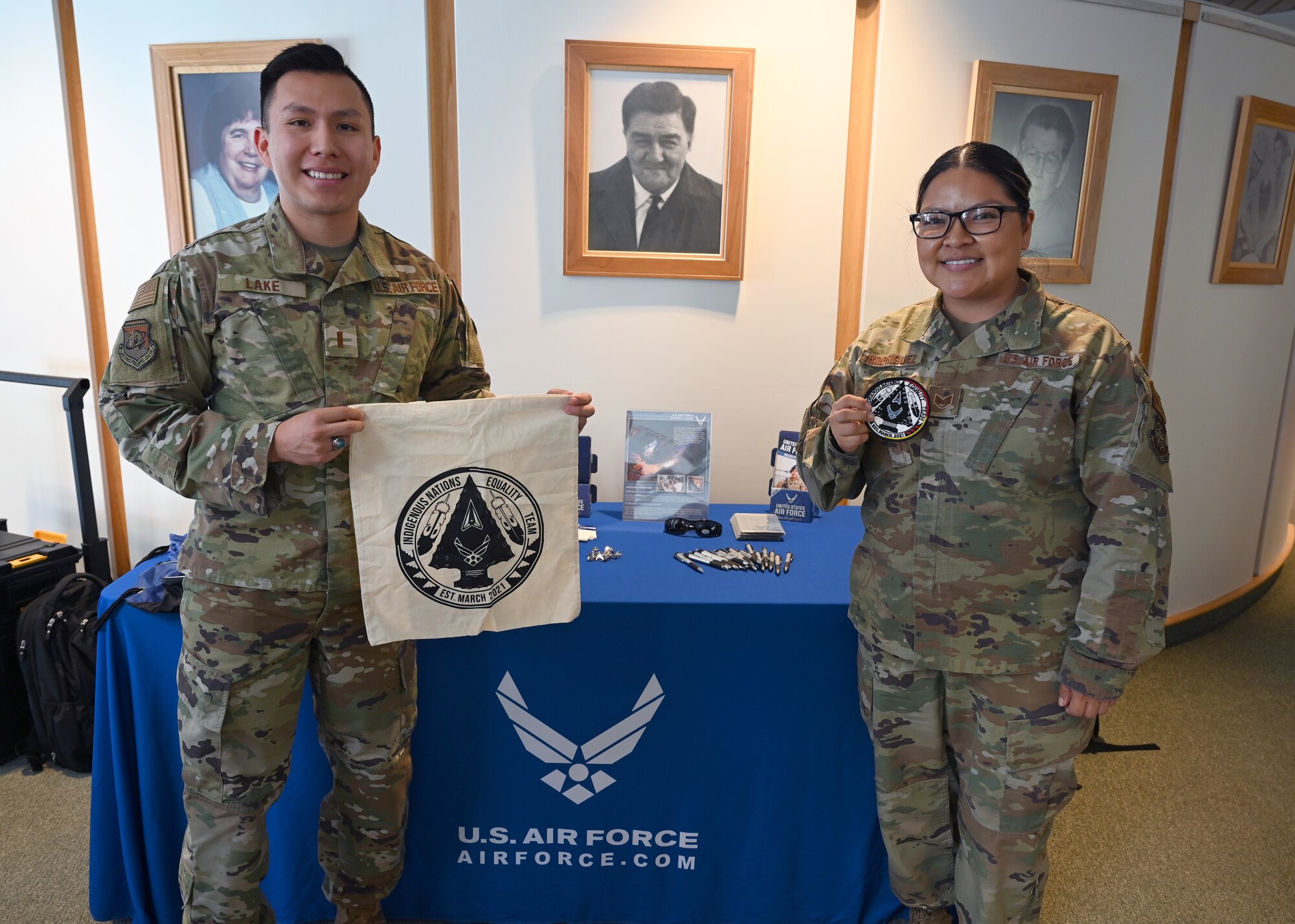 Second Lieutenant Nakai Lake, (left) an operations research analyst with the Air Force Personnel Center and Staff Sgt. Anastasia Rodriguez (right), an aerospace propulsion craftsman, 6th Maintenance Squadron, pose for a photo at the Fond Du Lac Tribal and Community College in Cloquet, Minn., Mar. 9, 2022. Both Lake and Rodriguez are Navajo and visited the school as part of the General Officer Inspire program which focuses on inspiring diverse groups of youth to join the Air Force. (U.S. Air Force photo by Tech. Sgt. Jessica Kind/Released)