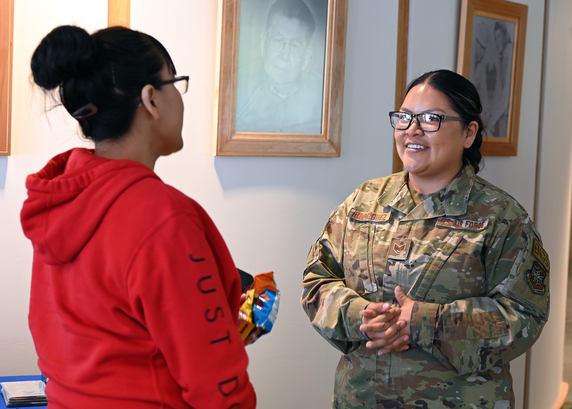 Staff Sgt. Anastasia Rodriguez, an aerospace propulsion craftsman, 6th Maintenance Squadron talks with a student at the Fond Du Lac Tribal and Community College in Cloquet, Minn., March 9, 2022. Rodriguez helped found the Indigenous Nations Equality Team (INET) in the U.S. Air Force and U.S. Space Force and has briefed at the Pentagon on the importance of diversity and inclusion and changes that would be more inclusive for Native Americans. (U.S. Air Force photo by Tech. Sgt. Jessica Kind/Released)