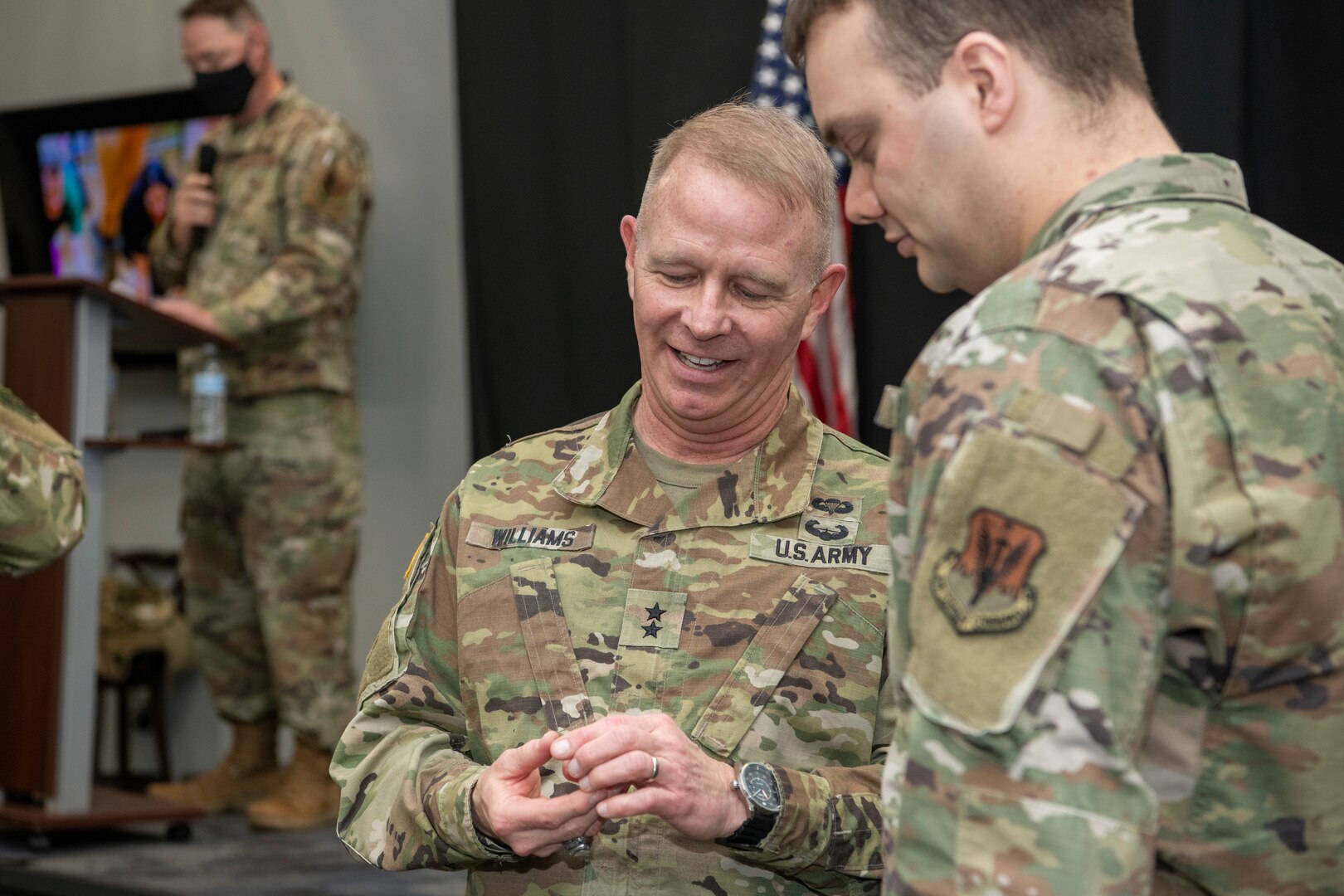 Maj. Gen. Timothy P. Williams, the Adjutant General of Virginia, presents his unique challenge coin at an end of mobilization ceremony Feb. 25, 2022, in Hampton, Virginia.