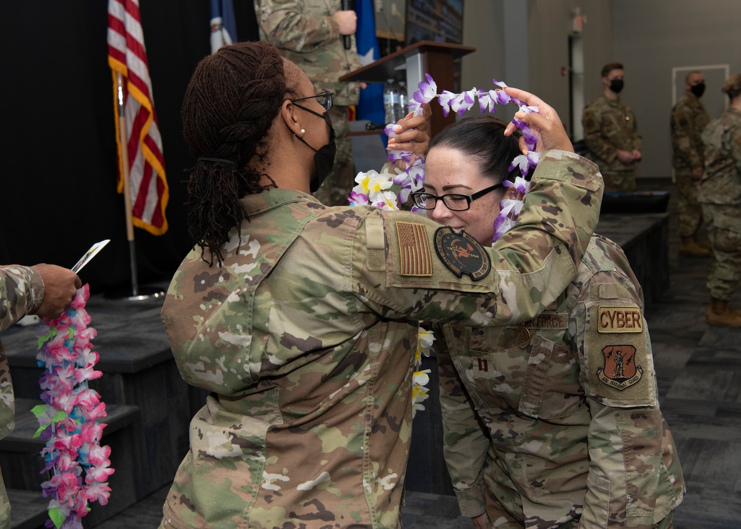 An Airman is presented with a lei at an end of mobilization ceremony Feb. 25, 2022, in Hampton, Virginia.