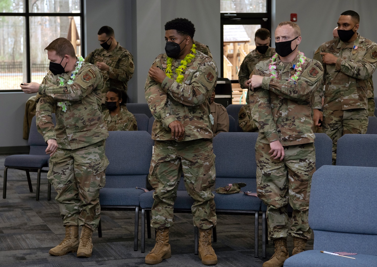 Members of the 185th Cyberspace Operations Group replace their 856th Cyber Protection Team patch to the 185th COS bat patch.