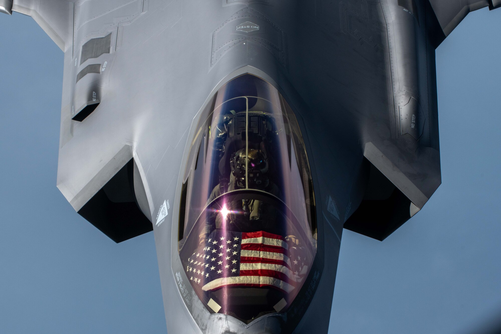 A jet flies behind an aircraft
