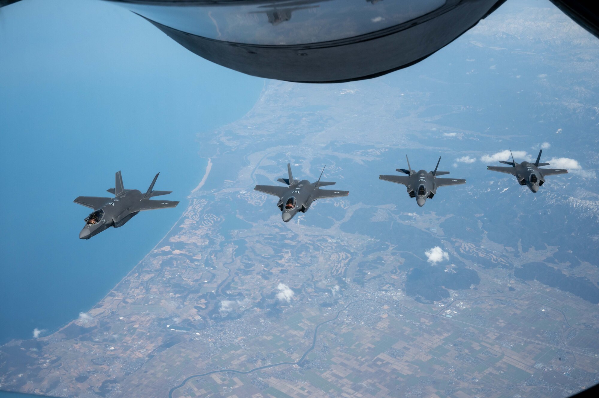 Four jets fly in a formation