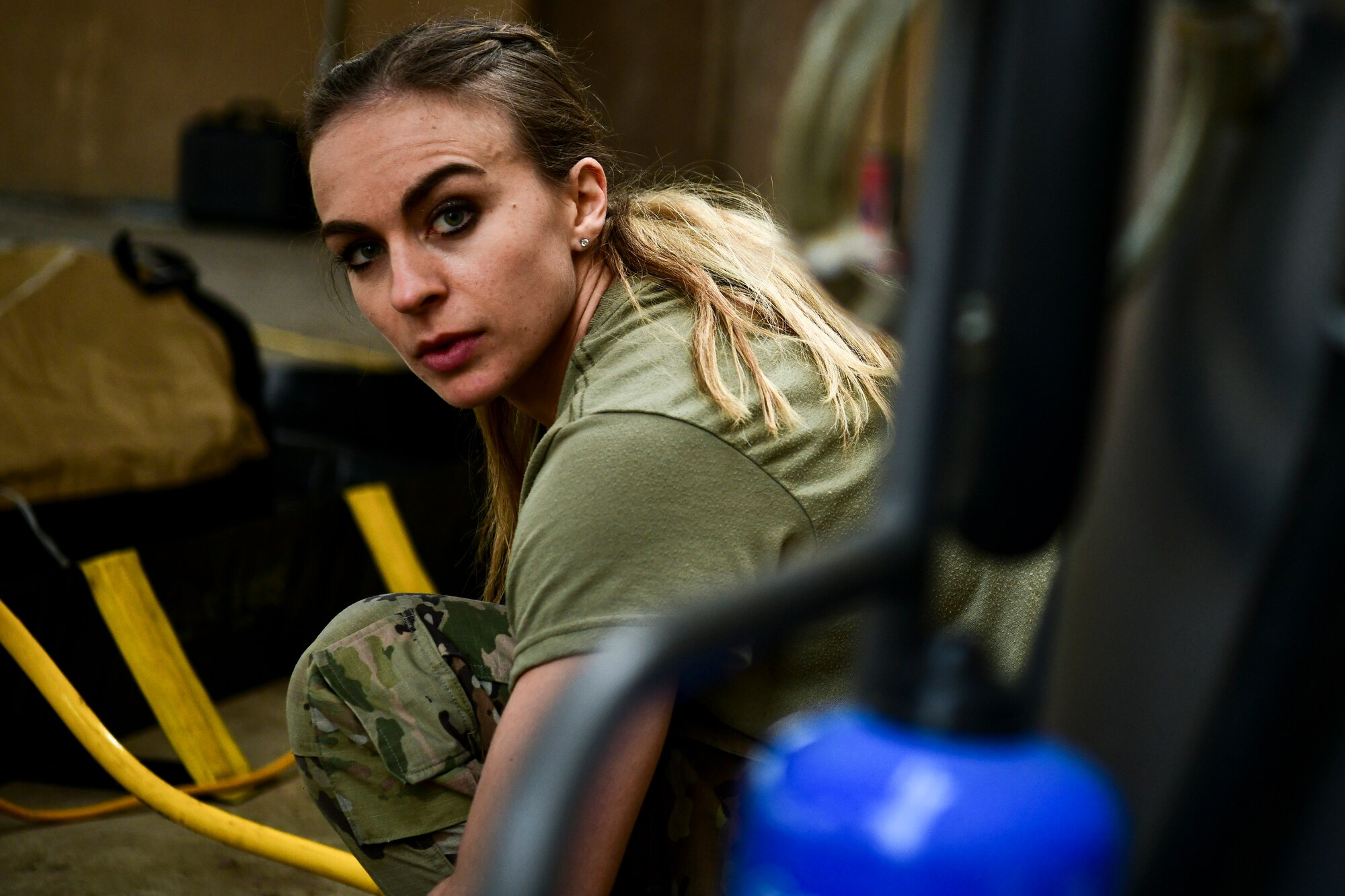 An Airman assembles a decon shelter.
