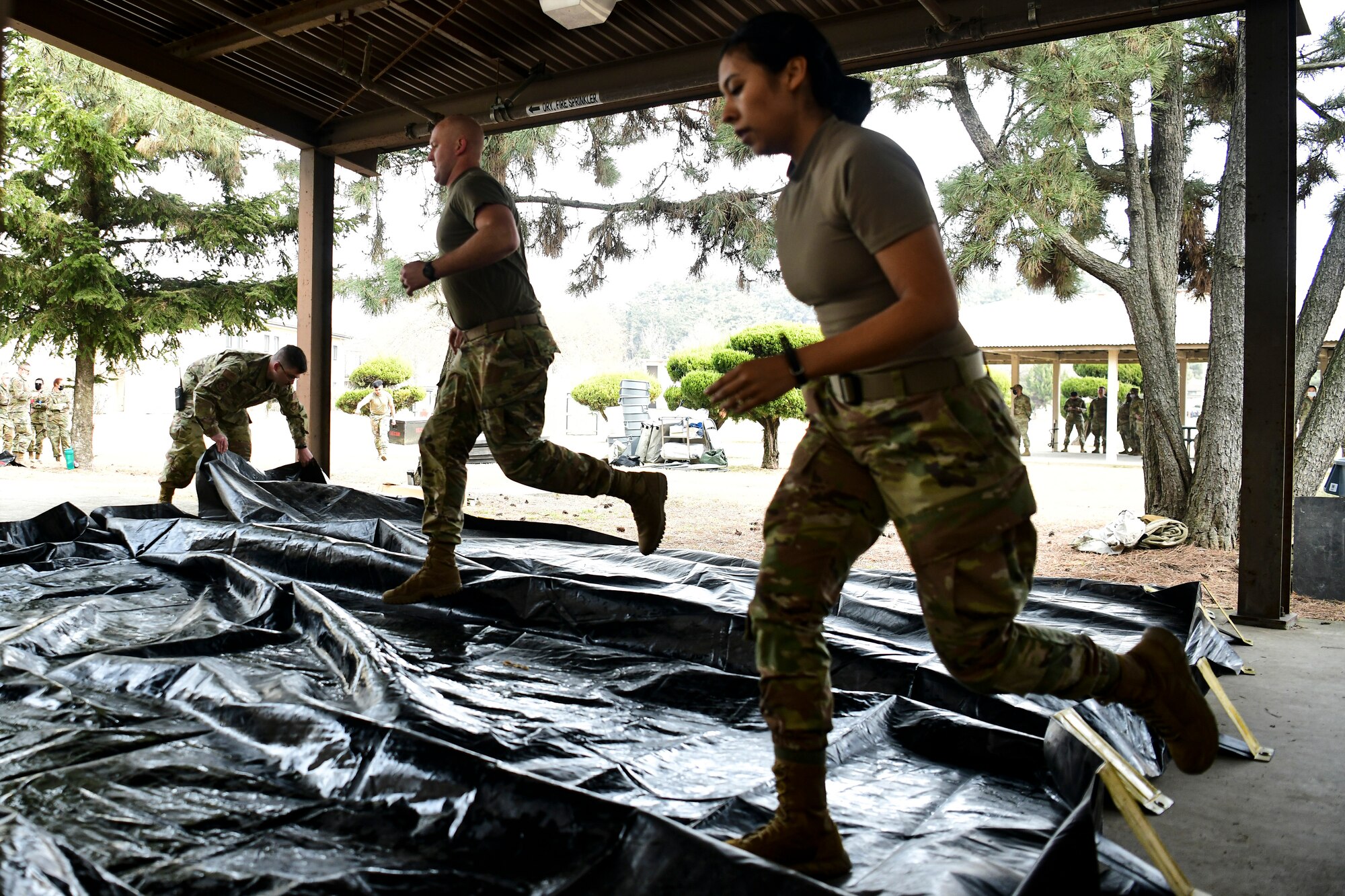 Airmen assemble a decon shelter.