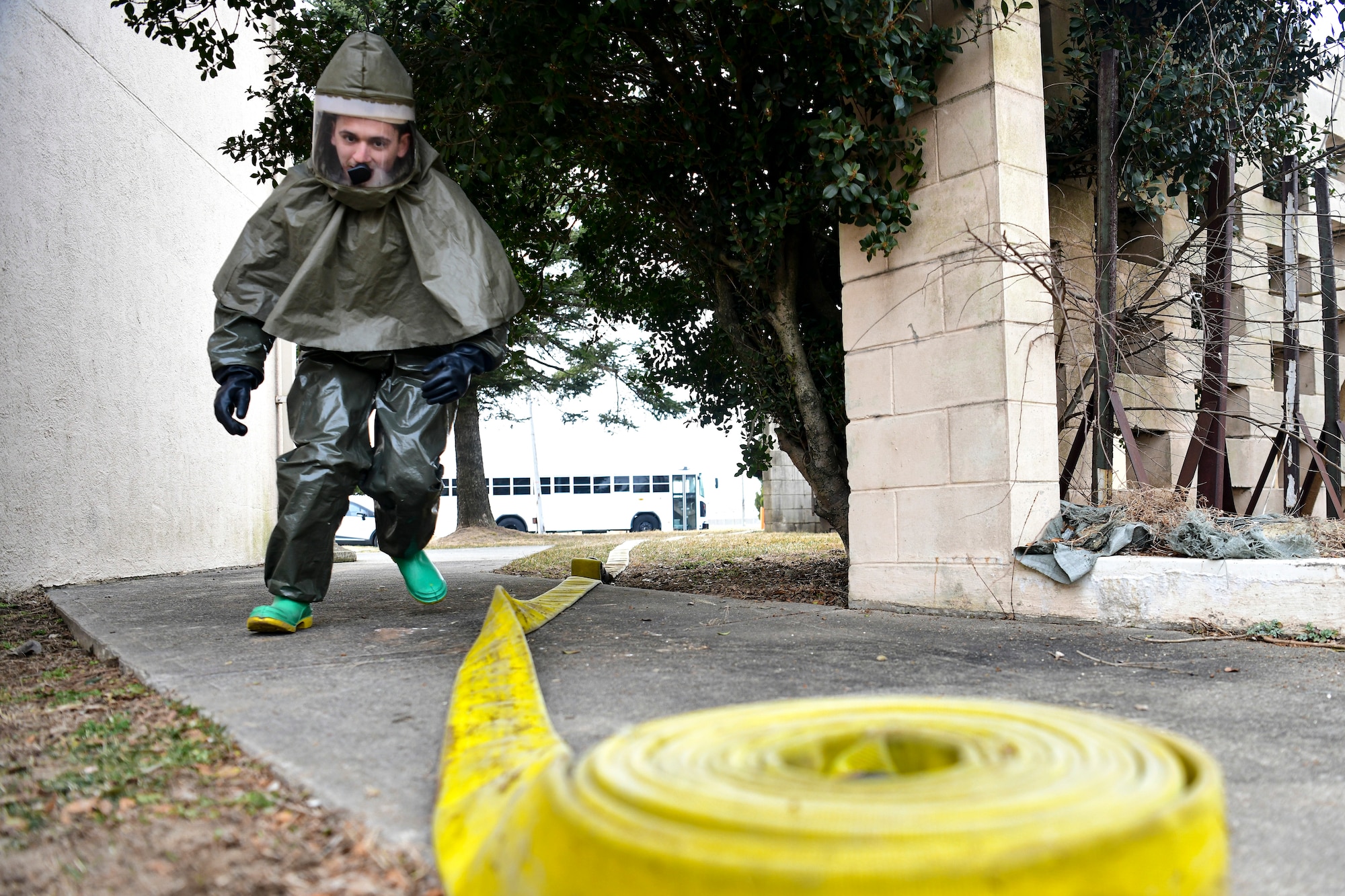 An Airman rushes to assemble a decon shelter.