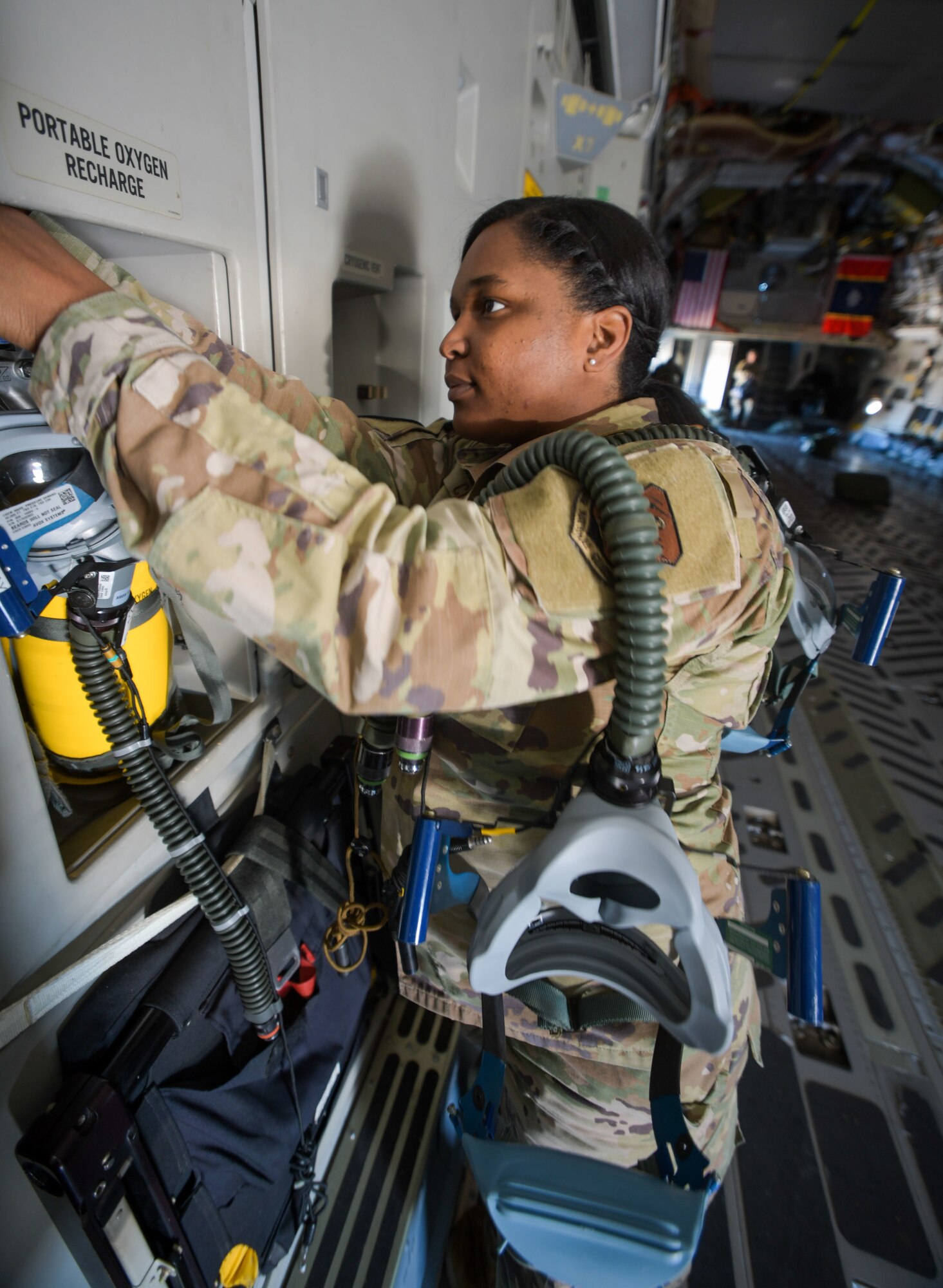 Tech. Sgt. Asia Clay, an aircrew flight equipment technician with the 172nd Operations Support Squadron, Jackson, Mississippi, inspects oxygen systems aboard a C-17 Globemaster III, Feb 15, 2022.