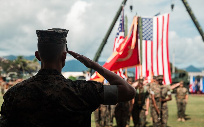 U.S. Marine Corps Col. Timothy S. Brady Jr, commanding officer, 3d Marine Littoral Regiment, 3d Marine Division renders a salute during the redesignation ceremony of 3d Marines to 3d MLR aboard Marine Corps Base Hawaii, March 3, 2022.