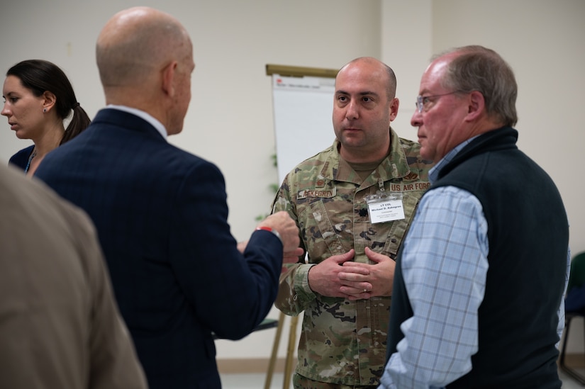 Resident speaks to two military members