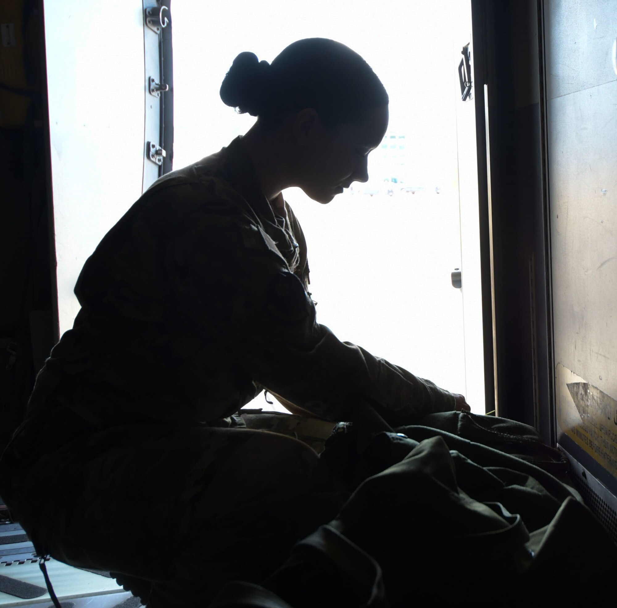 Senior Airman Abby Reid, a flight medical technician with the 183rd Aeromedical Evacuation Squadron, 172nd Airlift Wing, Jackson, Mississippi, prepares her kit aboard a C-17 Globemaster III March 6, 2022.