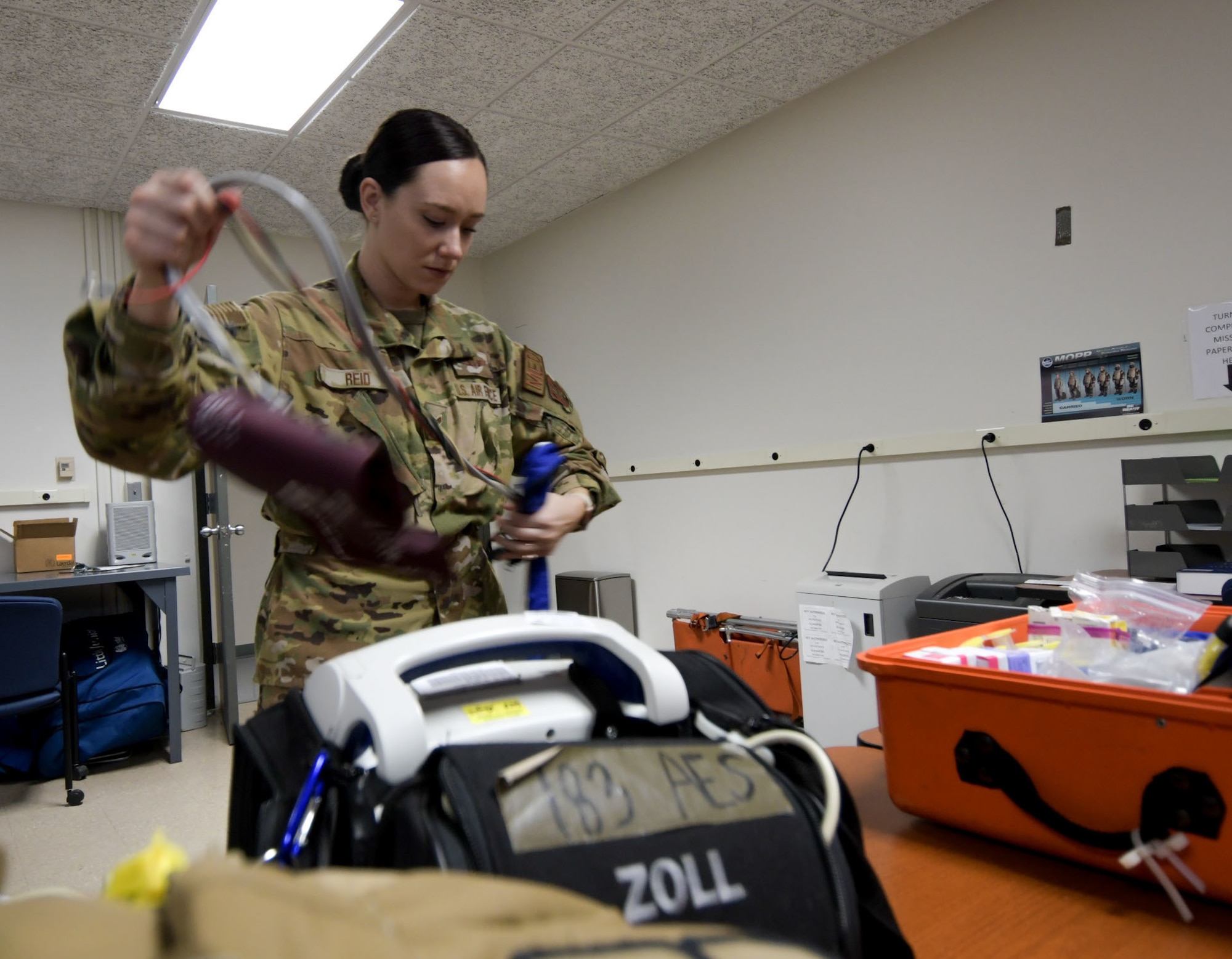Senior Airman Abby Reid, a flight medical technician with the 183rd Aeromedical Evacuation Squadron, 172nd Airlift Wing, Jackson, Mississippi, inspects a blood pressure monitor March 6, 2022.