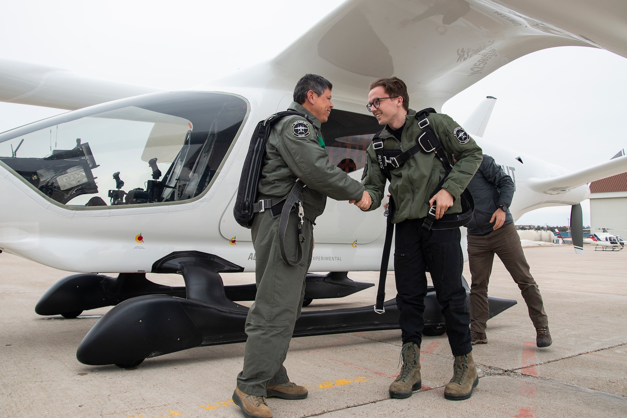 BETA test pilot Lochie Ferrier, right, congratulates Hank "HOG" Griffiths on successfully completing AFWERX’s first Airman flight of an eVTOL. (BETA Technologies photo/Brian Jenkins)