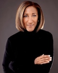 A professional studio photo of a woman