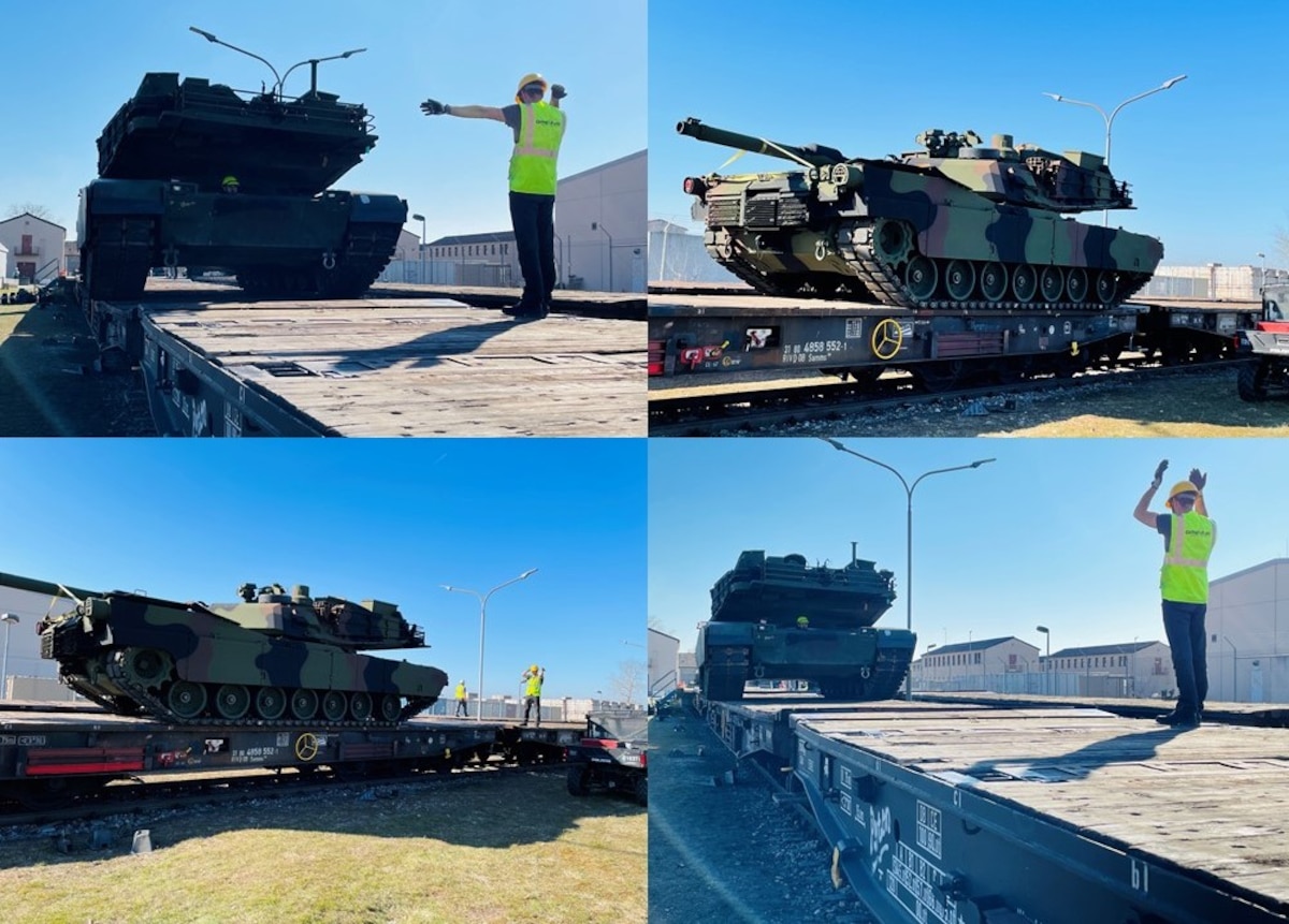 A contractor assigned to support the 405th Army Field Support Brigade ground guides an M1A2 Abrams main battle tank as it is loaded onto a German rail car at Coleman worksite in Mannheim, Germany. The 405th AFSB recently began augmenting its line-haul heavy equipment transporter deliveries of Army Prepositioned Stocks-2 equipment from Coleman to Grafenwoehr Training Area with Deutsche Bahn, or German railway, assets. More than two dozen armored vehicles and equipment pieces – ranging from tanks to Paladin self-propelled howitzers to Bradley fighting vehicles and more – were shipped via rail March 10. This was the first of many rail movements to come over the next few weeks. The APS-2 is being issued to 1st Armored Brigade Combat Team, 3rd Infantry Division at an Equipment Configuration and Handoff Area. The 1st ABCT is deployed to Germany from Fort Stewart, Georgia. Their deployment supplements the more than 90,000 U.S. personnel already deployed to or based in Europe as part of the United States’ longstanding commitment to European security and close defense partnership with host nations. (Photo by Maj. Allan Laggui)