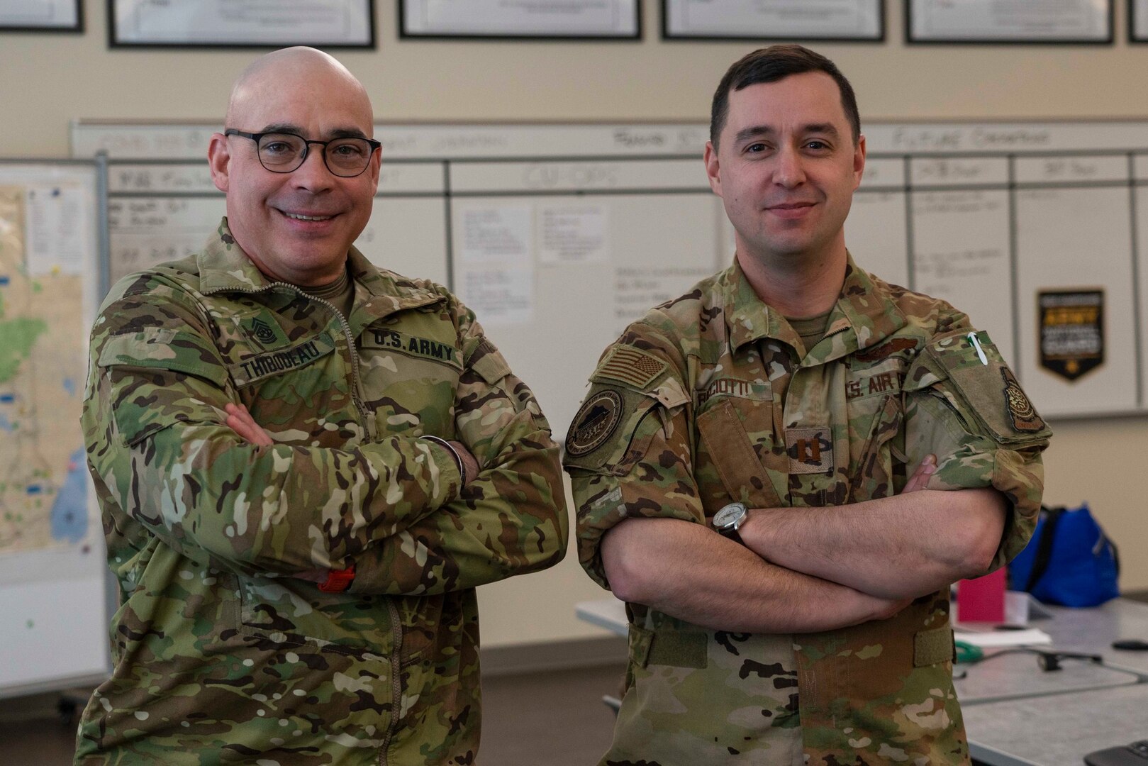 From left, Command Sgt. Maj. Michael Thibodeau and Capt. Jacob Ricciotti of Joint Task Force Winter Surge pose at the Edward Cross Training Center in Pembroke on March 2, 2022.