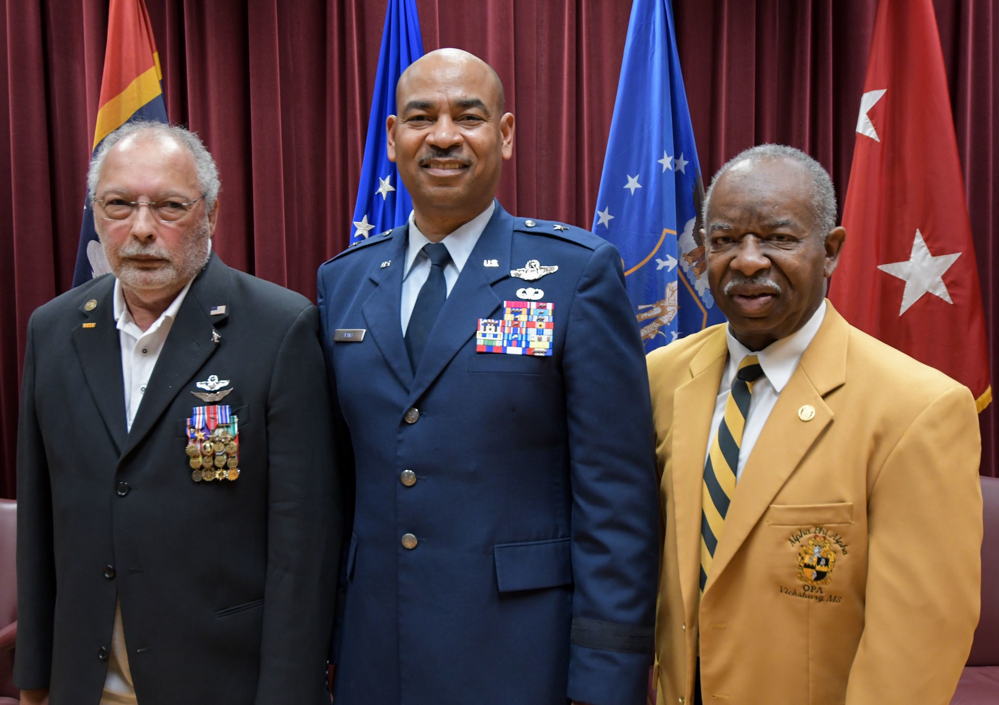 Brig. Gen. Edward H. Evans, Jr., chief of staff, Mississippi Air National Guard, shares a moment with Maj. (Ret.) Clarence “Clyde” Romero (left), the first African American Mississippi Air National Guard pilot for the 186th Air Refueling Wing, Meridian, Mississippi, and Capt. (Ret.) Brady Tonth, Jr (right), the first African American Mississippi Air National Guard pilot for the 172nd Airlift Wing, Jackson, Mississippi, following his promotion ceremony at Mississippi National Guard Joint Force Headquarters, Jackson, Mississippi, March 5, 2022.