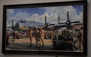 A painting of the Enola Gay on Tinian sits on the wall at the 509th Bomb Wing Headquarters building.