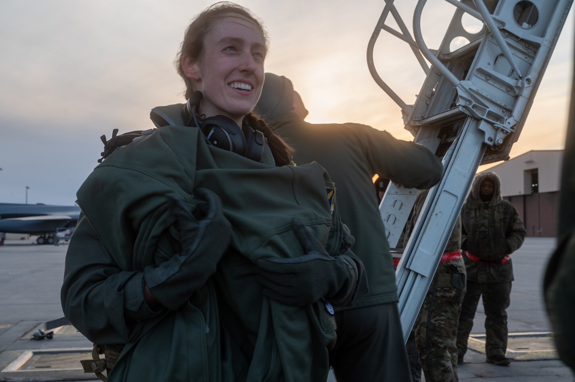1st Lt. Meaghan Dowd, 34th Bomb Squadron aircrew member, disembarks from a B-1B Lancer after a Bomber Task Force mission at Ellsworth Air Force Base, S.D., Feb. 1, 2022. The B-1B Lancers participated in a long-distance, roundtrip flight from the United States to the United Kingdom in order to commemorate the 80th anniversary of the Eighth Air Force. (U.S. Air Force photo by Senior Airman Michael Ward)