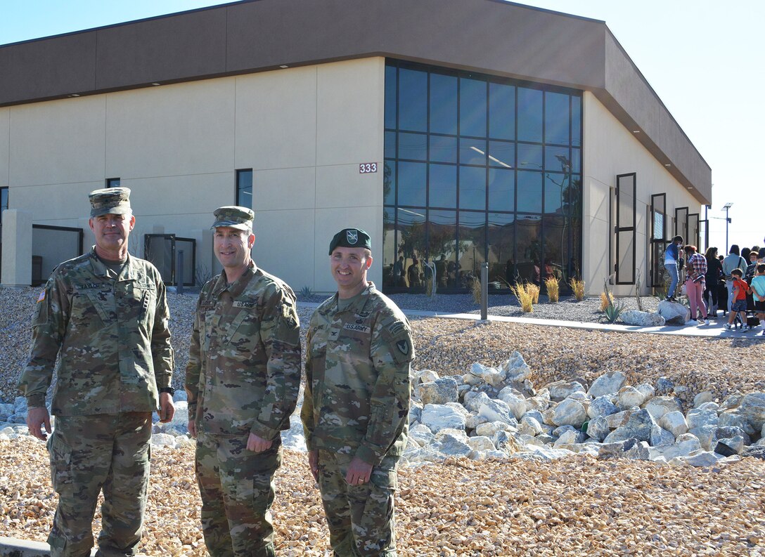 From left to right, Brig. Gen Curt Taylor, commanding general of the National Training Center at Fort Irwin; Maj. Kevin Stucker, deputy commander of the U.S. Army Corps of Engineers Los Angeles District; and Col. Jason Clarke, Fort Irwin garrison commander, pose for a picture in front of the new Fort Irwin Library – Building 333 – following a March 9 ribbon-cutting ceremony signifying the opening of the facility. The U.S. Army Corps of Engineers Los Angeles District’s Fort Irwin Resident Office managed the construction of the new $6-million facility, which replaces a more than 25-year-old library on the installation. The new library is energy-efficient and LEED-Silver certified. Like many of the other facilities the Corps has built at Fort Irwin, the landscape around the library incorporates low-volume irrigation methods and xeriscaping techniques.