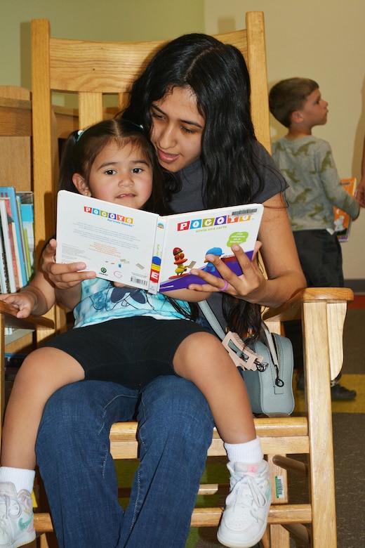 Brisia Camarena of Fort Irwin reads the book “Pocoyo” to her daughter, Ella, March 9 at the new Fort Irwin Library at Fort Irwin, California. About 400 Fort Irwin community members checked out the new facility following a ribbon-cutting ceremony signifying its grand opening. The U.S. Army Corps of Engineers Los Angeles District’s Fort Irwin Resident Office managed the construction of the facility.