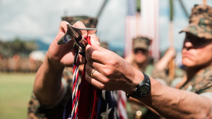 U.S. Marine Corps Col. Timothy S. Brady Jr and Sgt. Maj. Rodney E. Nevinger, 3rd Marine Littoral Regiment commanding officer and sergeant major, retire the 3rd Marines’ unit colors during the redesignation ceremony of 3rd Marines to 3rd MLR aboard Marine Corps Base Hawaii, March 3, 2022. The 3rd MLR will serve as a key enabler for joint, allied, and partnered forces, will integrate with naval forces, and will enable multi-domain maneuver and fires within contested spaces.  The transition of 3rd Marines to 3rd MLR is in accordance with Force Design 2030 and one of the first major steps to facilitating a shift as the Marine Corps divests in legacy capabilities and builds a force that is optimized for operations envisioned within the Commandant’s Planning Guidance.