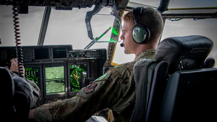 U.S. Air Force Capt. Riley Feeney, an instructor pilot assigned to the 19th Special Operations Squadron, flys an AC-130J Ghostrider during a training flight, Eglin Range complex, Florida, March 31, 2021. The 19th SOS is the Air Force Special Operations Command's formal school for the AC-130J Ghostrider and MC-130H Talon II, and they are responsible for assessing, educating and professionally developing SOF Airmen and rapidly developing innovative courses and technologies to meet emerging AFSOC requirements. (U.S. Air Force photo by Tech. Sgt. Michelle Di Ciolli)