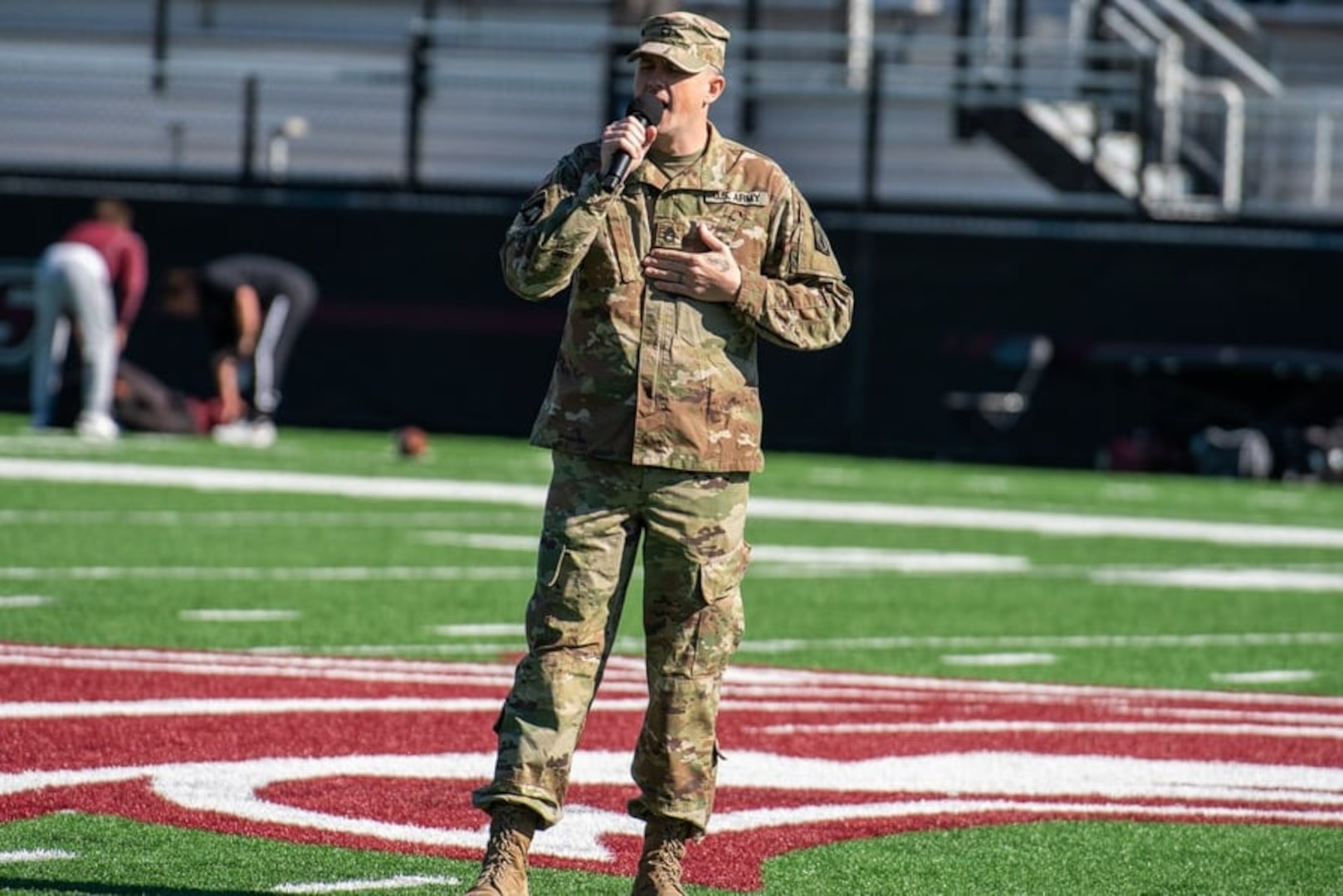 Illinois Army National Guard Sgt. 1st Class David Allen Stone performs ‘Bury These Burdens’ prior to kick-off of the Southern Illinois University Military Appreciation football game against Missouri State University Nov. 6, 2021. Stone wrote and recorded the song to help anyone coping with mental illness and thoughts of suicide.
