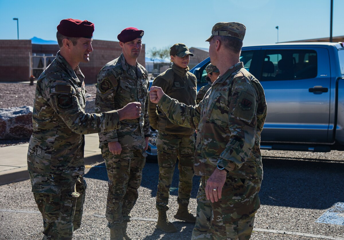 A photo of Airmen greeting each other.