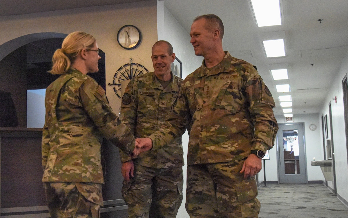 A photo of Airmen shaking hands