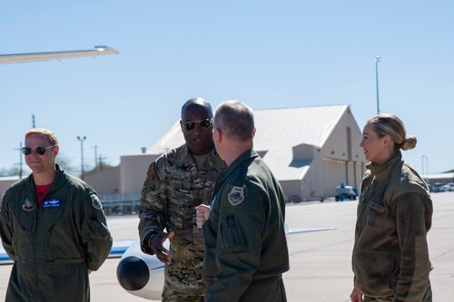 A photo of Airmen greeting each other.