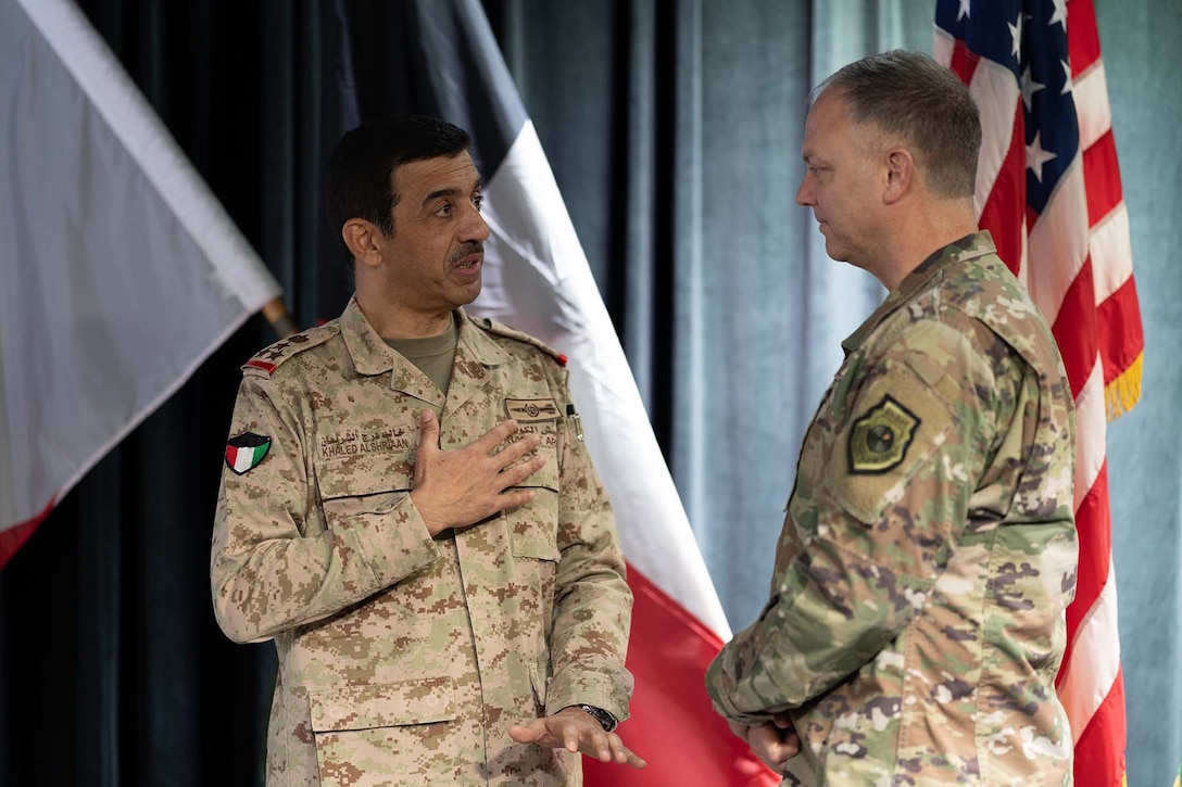 Brig Gen. Khaled Al-Shriann, Deputy Commander of the Kuwaiti Air Defense Force, left, emphasizes a thought during a discussion with Maj. Gen. Bradley Swanson, Deputy Operations Officer, North American Aerospace Command (NORAD), right, after a briefing provided during an exercise Eagle Resolve 22 senior leader seminar, at Fort Carson, Colorado, March 10, 2022. The seminar included senior military leaders from Kuwait, Bahrain and the Kingdom of Saudi Arabia. The seminar was an opportunity to exchange the experiences and expertise of defending populations and infrastructure against malign actors that threaten Gulf Cooperation Council nations. (U.S. Army photo by Staff Sgt. Leo Jenkins)