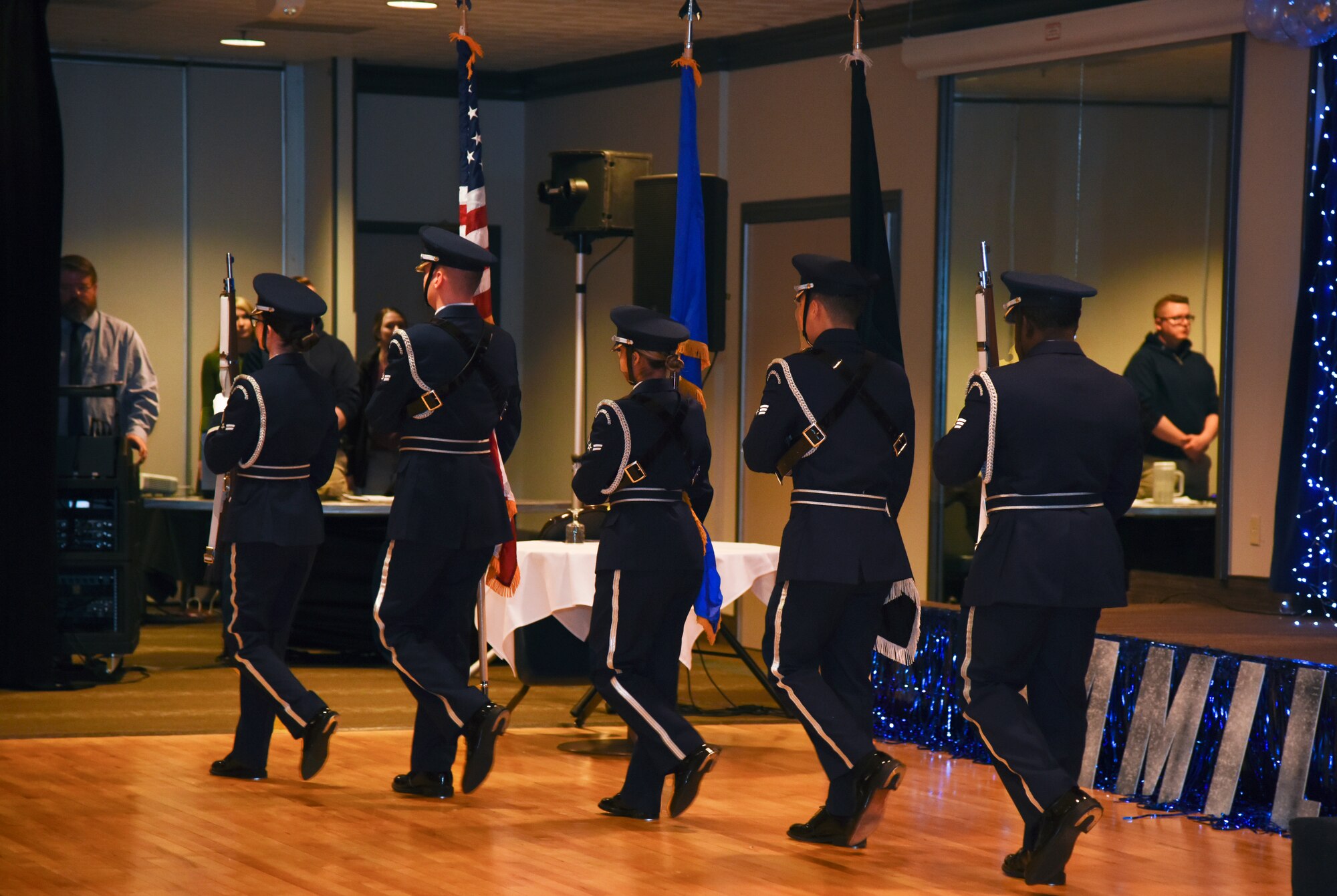 The High Frontier Honor Guard presents colors at the Annual Awards Banquet at Peterson Space Force Base, Colorado, Mar. 11, 2022. The Honor Guard members are trained to showcase unity, precision and military bearing.