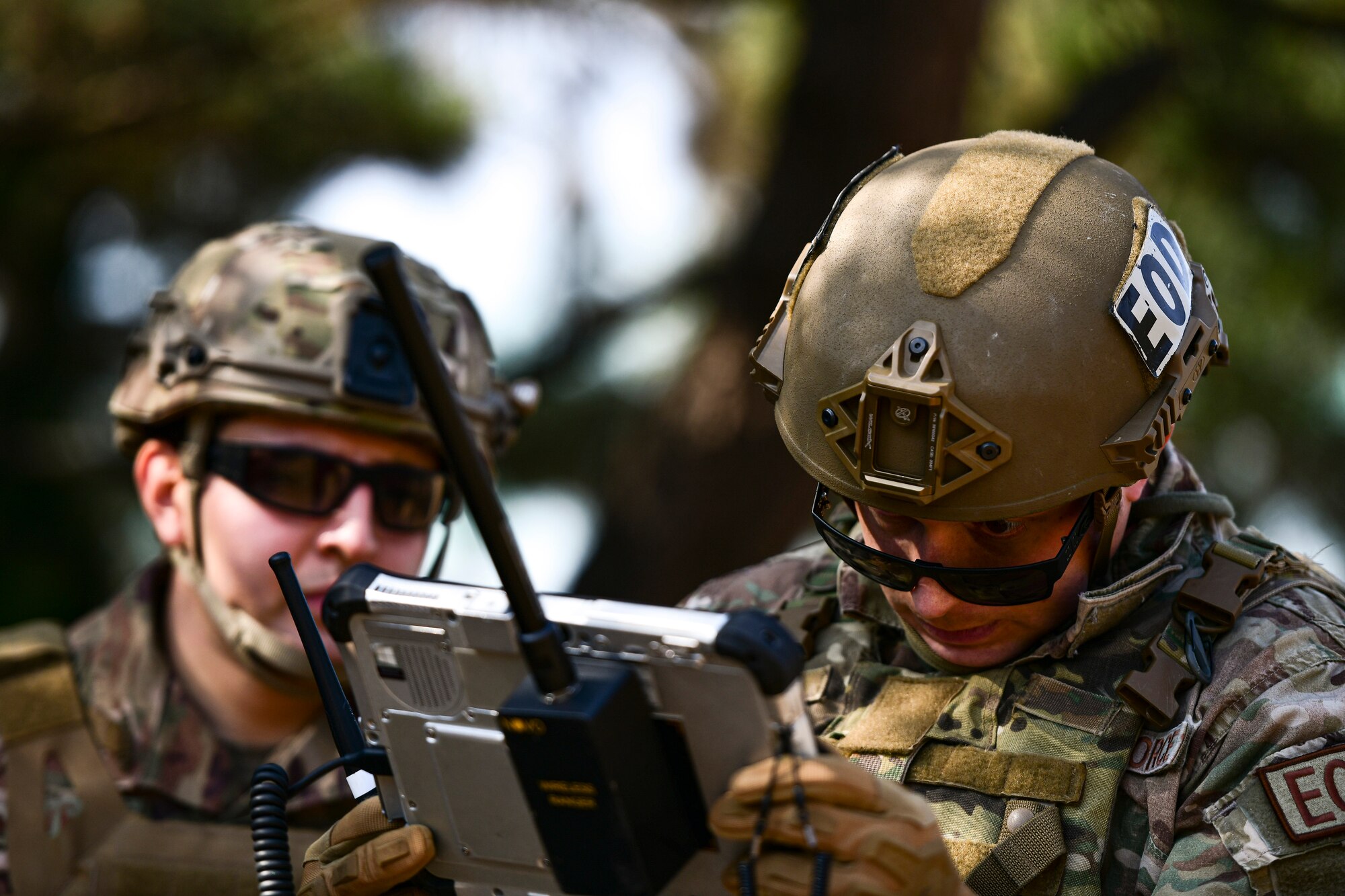Airmen examine an x-ray.