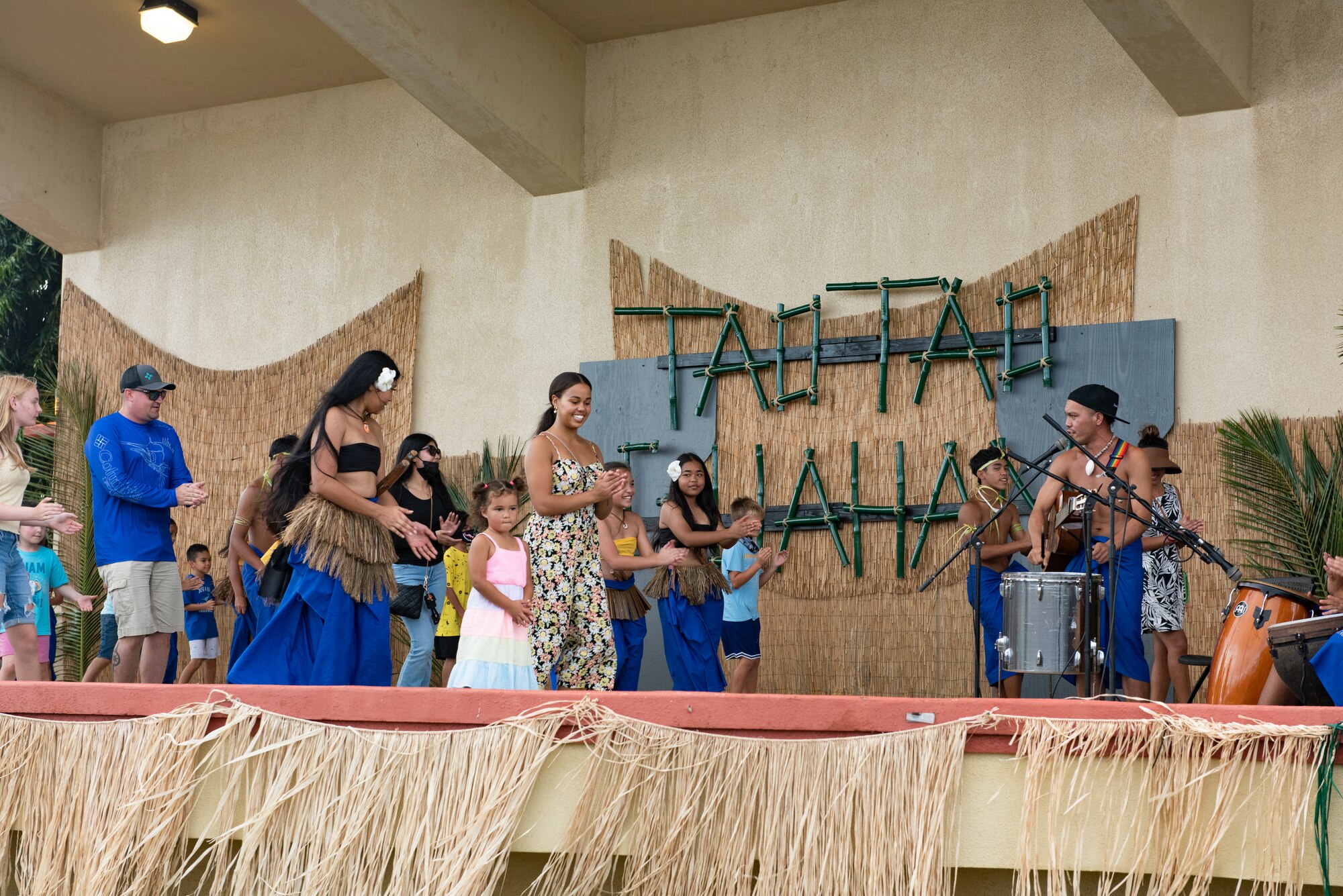 Team Andersen members learn a native dance from the cultural group, Guma Ma’higa, during the annual Tao Tao Guahan event March 12, 2022, at Andersen Air Force Base, Guam. The event focused on immersing Team Andersen members in the local culture of Guam and strengthen the partnerships of the two communities. The event included booths, cultural music and dance, storytelling, food and more. (U.S. Air Force Photo by Senior Airman Helena Owens)