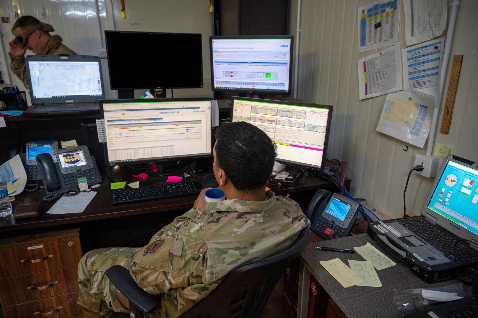 A 332d Expeditionary Operations Support Squadron Weather Flight technician observes weather information at an undisclosed location in Southwest Asia, March 3, 2022. The 332d EOSS Weather Flight delivers customized meteorological support for the 332d Air Expeditionary Wing's varied structural and agency sensitivities.
(U.S. Air Force photo by Tech. Sgt. Lauren M. Snyder)(This photo has been altered for operational security purposes.)
