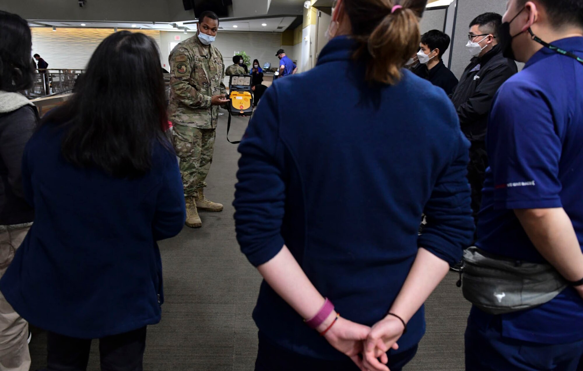 Staff Sgt. Mario Fosque, 51st Medical Group medical technician, explains a LIFEPAK CR–T AED Trainer during a cardiopulmonary resuscitation (CPR) class at Osan Air Base, Republic of Korea on March 9, 2022.