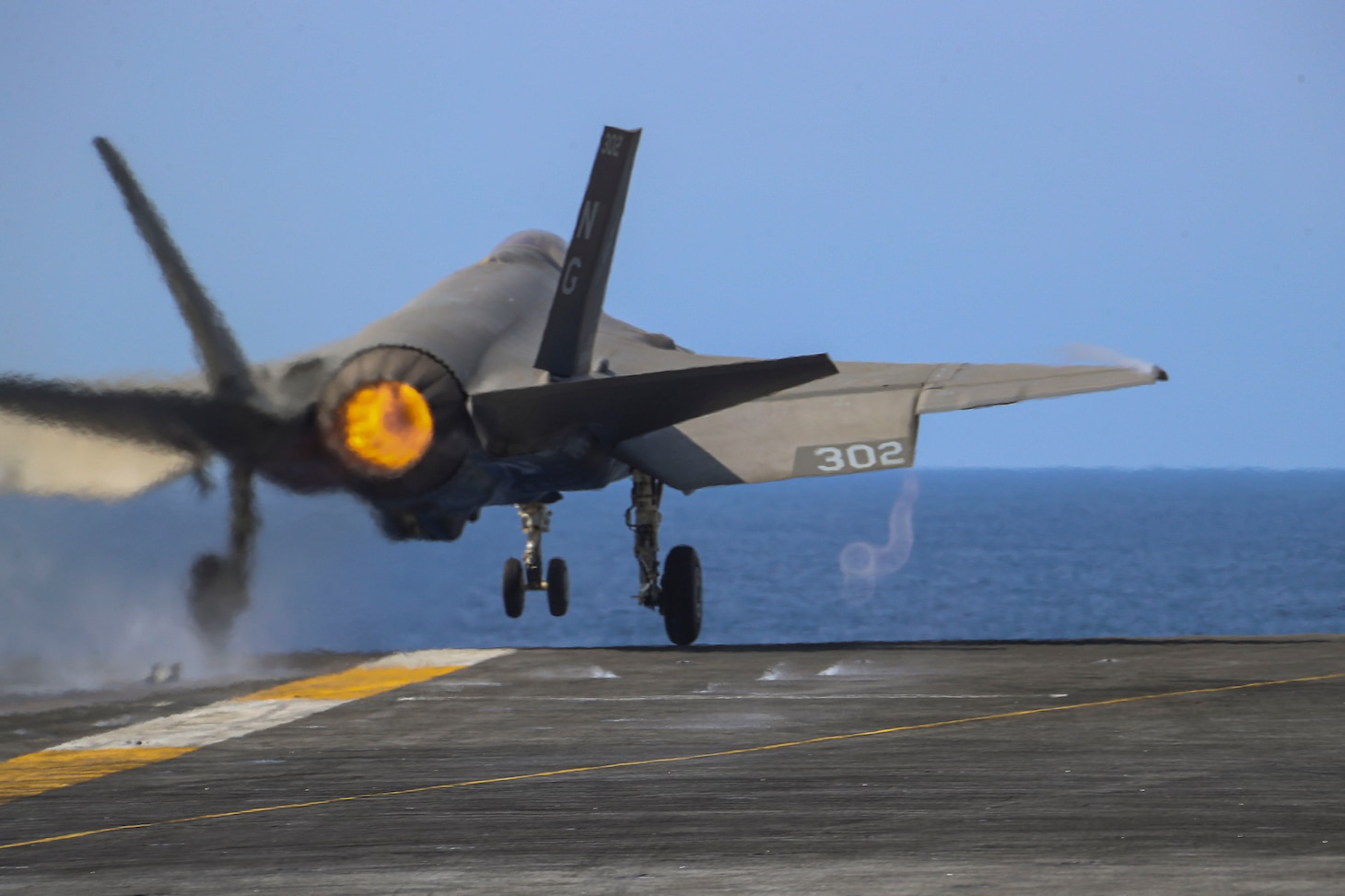 PHILIPPINE SEA (March 15, 2022) An F-35C Lightning II, assigned to the "Black Knights" of Marine Fighter Attack Squadron (VMFA) 314, launches from the flight deck of the Nimitz-class aircraft carrier USS Abraham Lincoln (CVN 72). Abraham Lincoln Strike Group is on a scheduled deployment in the U.S. 7th Fleet area of operations to enhance interoperability through alliances and partnerships while serving as a ready-response force in support of a free and open Indo-Pacific region. (U.S. Navy photo by Mass Communication Specialist 3rd Class Javier Reyes)