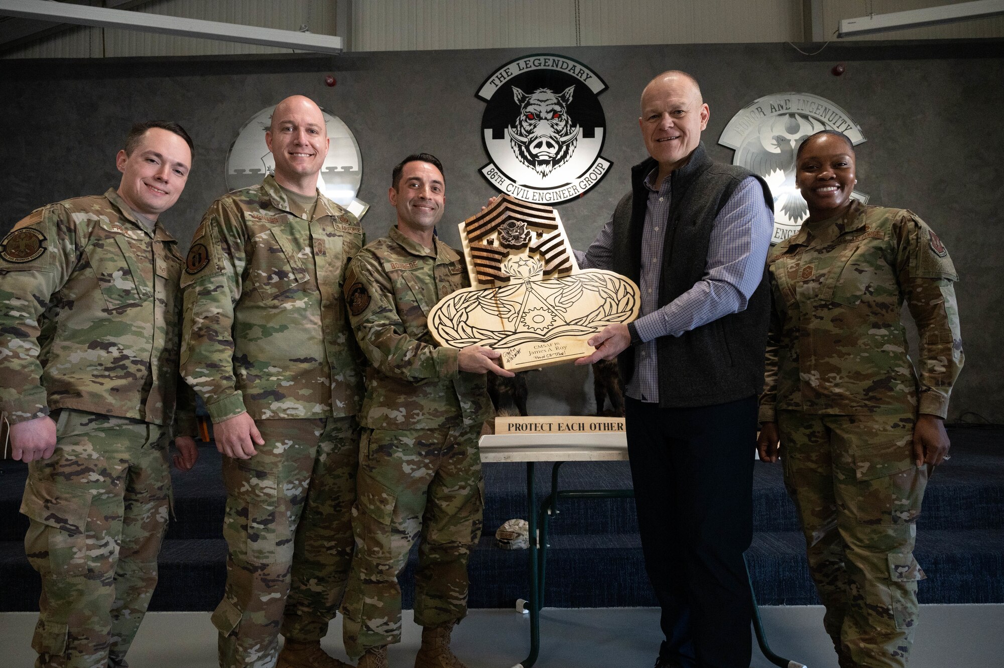 CMSAF poses for a photo with others.