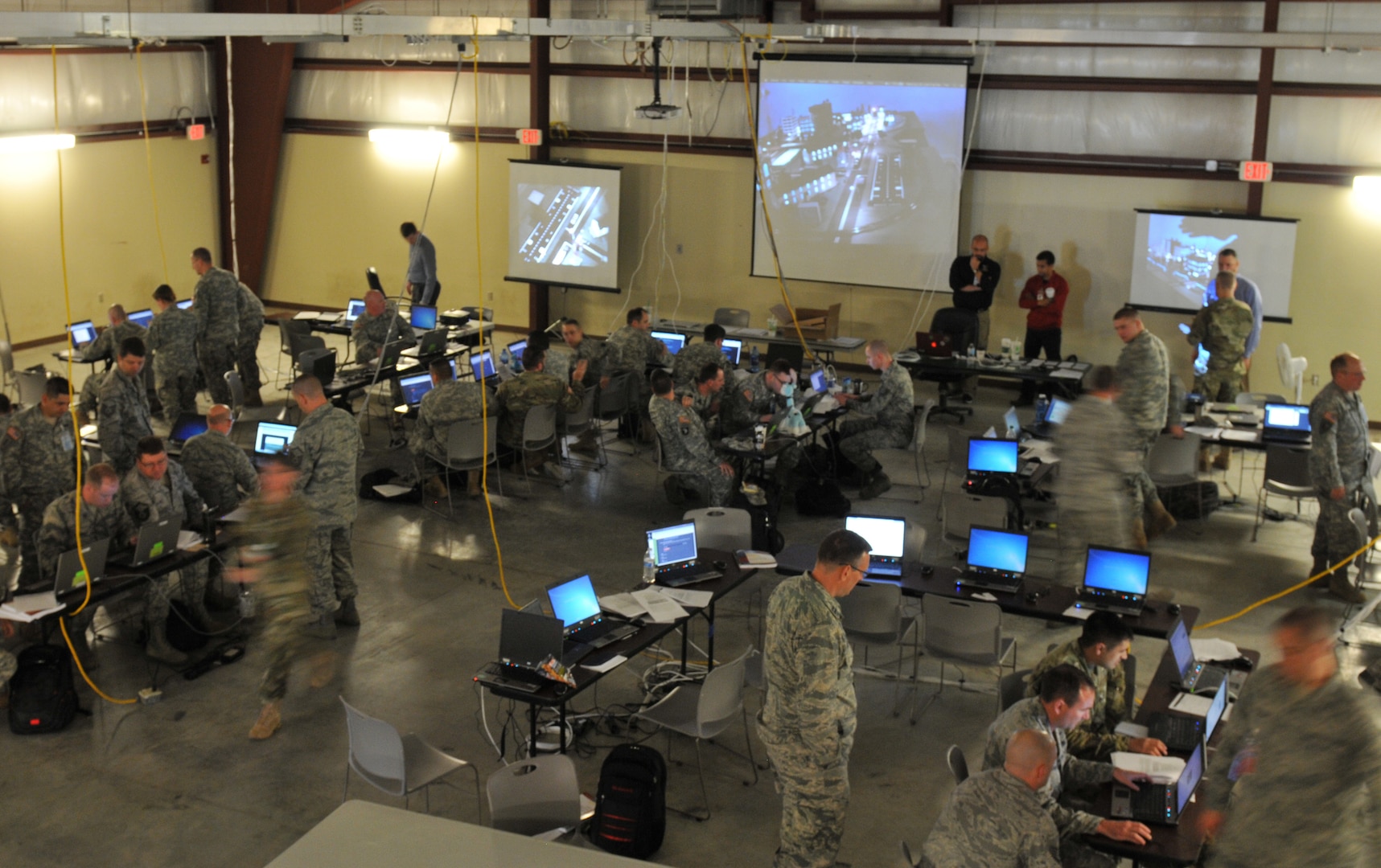 United States Army National Guard Soldiers and Airmen move swiftly through the Cyber City area of operation as Blue Team defenders during the Cyber Shield 2016 exercise at Camp Atterbury, IN, April 20, 2016. (Photo by SGT Stephanie A. Hargett, USA)